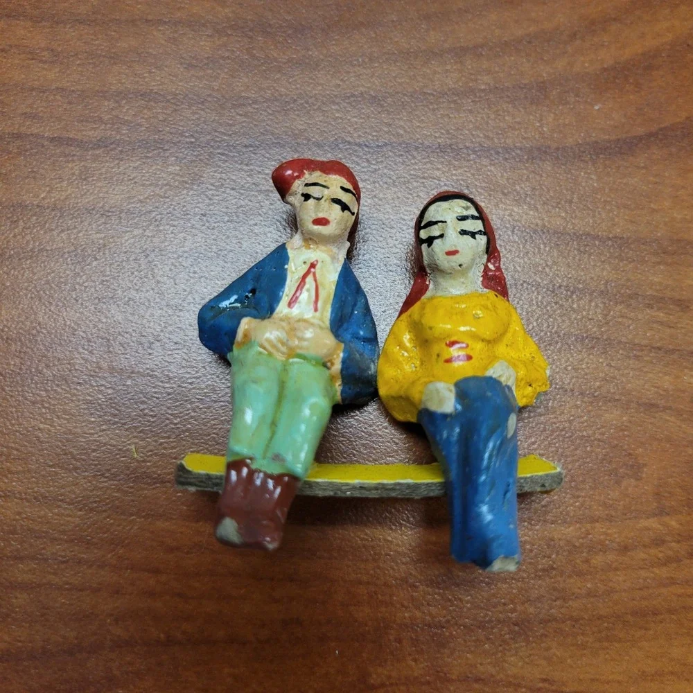 Cast Iron Vintage Hand painted man & woman shelf sitters
